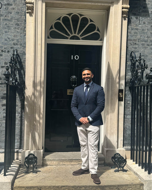 man standing outside of a house